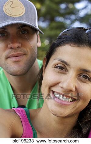 Stock Image - Smiling couple outdoors. Fotosearch