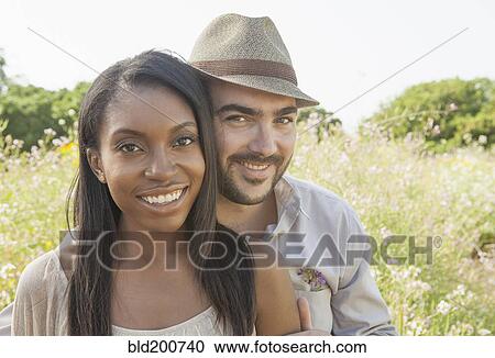 Stock Image - Smiling couple outdoors. Fotosearch