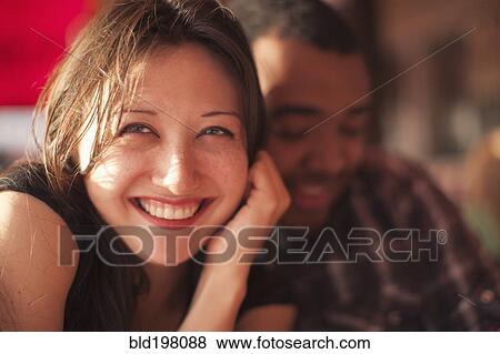 Smiling couple sitting together View Large Photo Image Stock Photo - Smiling couple sitting together. Fotosearch