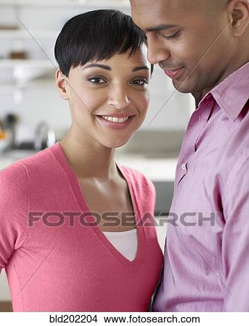 Picture - Smiling couple standing together. Fotosearch