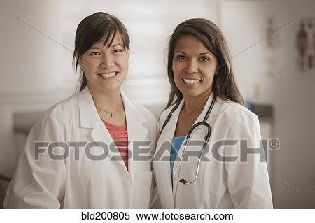 Smiling doctor standing together View Large Photo Image Stock Photography - Smiling doctor standing together. Fotosearch