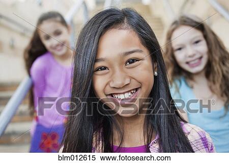 Stock Photography - Smiling girls. Fotosearch