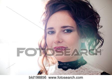 Stock Photograph - Smiling, glamorous Caucasian woman. Fotosearch
