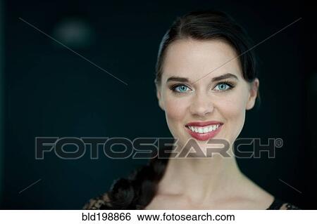 Stock Photograph - Smiling, glamorous woman. Fotosearch