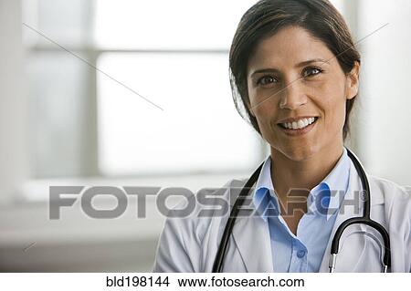 Smiling Hispanic doctor View Large Photo Image Picture - Smiling Hispanic doctor. Fotosearch