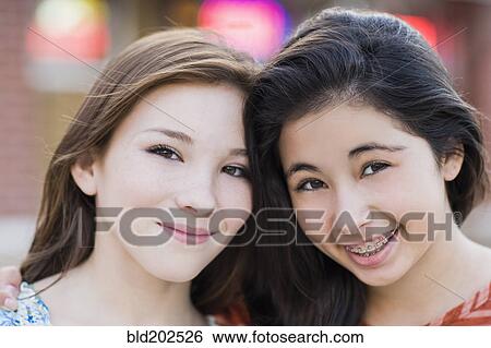 Stock Photograph - Smiling Hispanic friends. Fotosearch