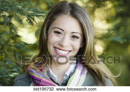 Smiling Hispanic woman in colorful scarf View Large Photo Image Stock Image - Smiling Hispanic woman in colorful scarf. Fotosearch