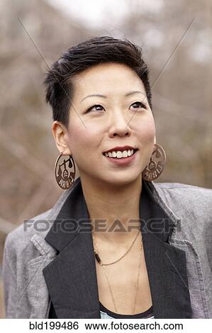 Smiling Korean woman View Large Photo Image Stock Photograph - Smiling Korean woman. Fotosearch