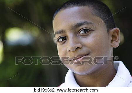 Stock Image - Smiling mixed race boy. Fotosearch