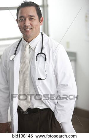 Stock Photography - Smiling mixed race doctor. Fotosearch