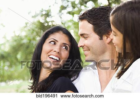 Smiling mixed race family View Large Photo Image Stock Image - Smiling mixed race family. Fotosearch