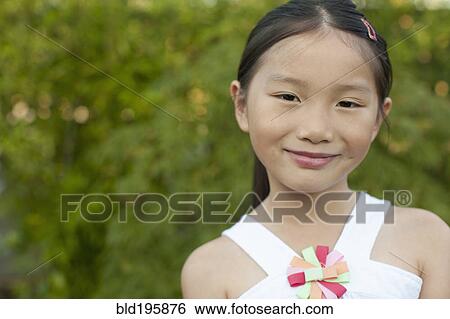 Smiling mixed race girl View Large Photo Image Stock Photograph - Smiling mixed race girl. Fotosearch