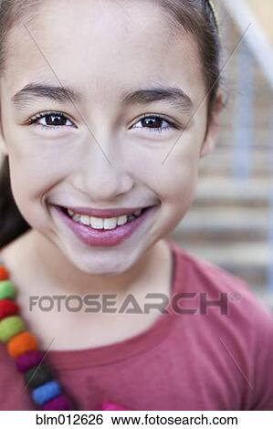 Stock Photograph - Smiling mixed race girl. Fotosearch