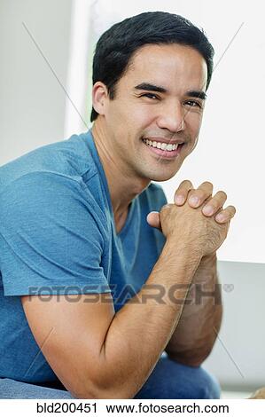 Stock Image - Smiling mixed race man. Fotosearch