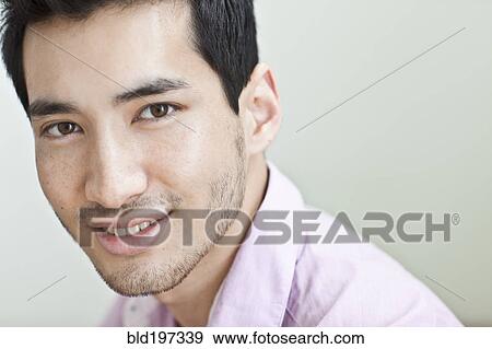 Stock Photo - Smiling mixed race man. Fotosearch