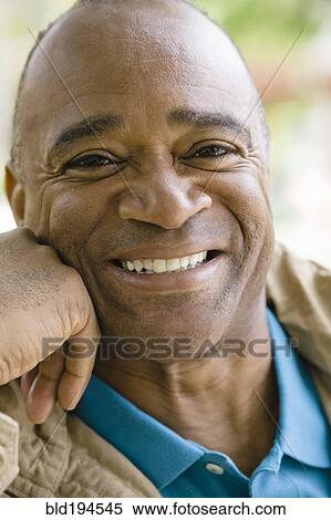 Stock Photography - Smiling mixed race man. Fotosearch