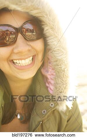 Smiling mixed race woman in fur hood View Large Photo Image Stock Photograph - Smiling mixed race woman in fur hood. Fotosearch
