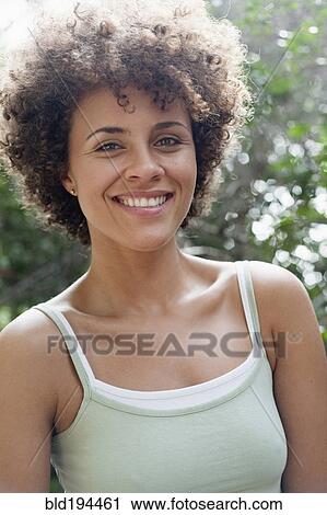 Smiling mixed race woman View Large Photo Image Stock Image - Smiling mixed race woman. Fotosearch