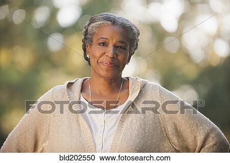 Stock Image - Smiling mixed race woman. Fotosearch