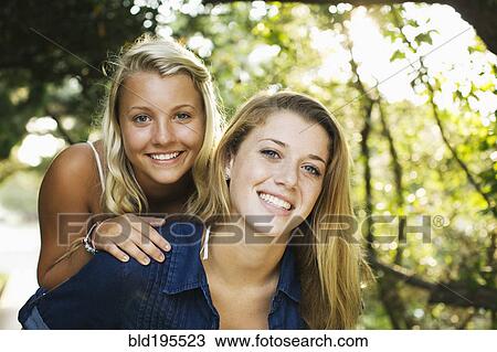 Smiling teenage girls View Large Photo Image Stock Image - Smiling teenage girls. Fotosearch