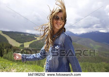 Smiling woman walking outdoors View Large Photo Image Stock Image - Smiling woman walking outdoors. Fotosearch