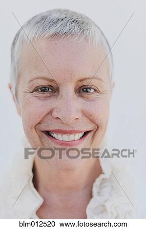 Smiling woman with short gray hair View Large Photo Image Stock Image - Smiling woman with short gray hair. Fotosearch