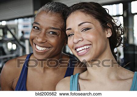 Smiling women in health club View Large Photo Image Stock Image - Smiling women in health club. Fotosearch
