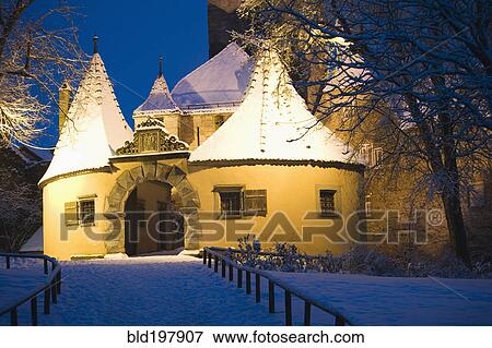 Stock Photo - Snow covered village building at night. Fotosearch