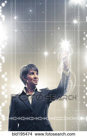 Sparks emerging from mixed race businesswoman's finger View Large Photo Image Picture - Sparks emerging from mixed race businesswoman's finger. Fotosearch
