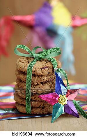 Stack of cookies tied with green ribbon View Large Photo Image Picture - Stack of cookies tied with green ribbon. Fotosearch