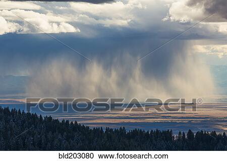 Storm clouds over rural valley View Large Photo Image Stock Image - Storm clouds over rural valley. Fotosearch