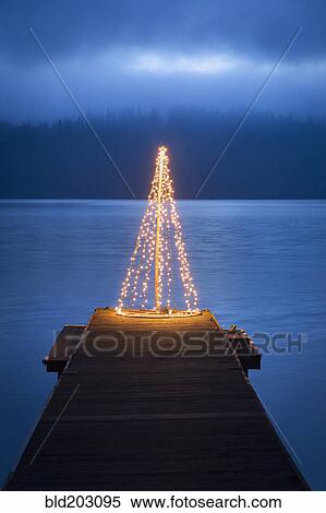 String of lights in tree shape on wooden pier View Large Photo Image Stock Photography - String of lights in tree shape on wooden pier. Fotosearch