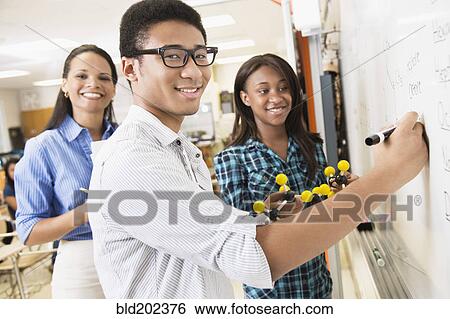 Stock Photograph - Students learning about chemistry model. Fotosearch