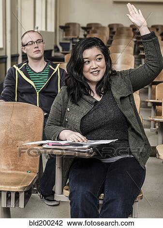 Stock Image - Students studying in classroom. Fotosearch