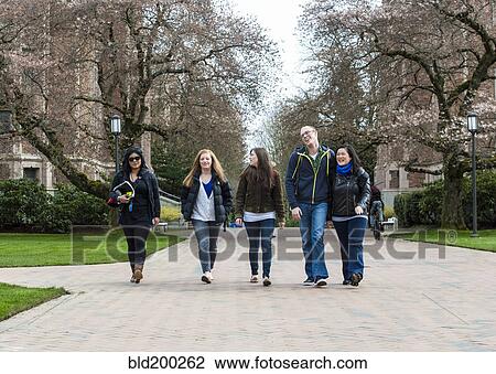 Stock Image - Students walking on campus together. Fotosearch
