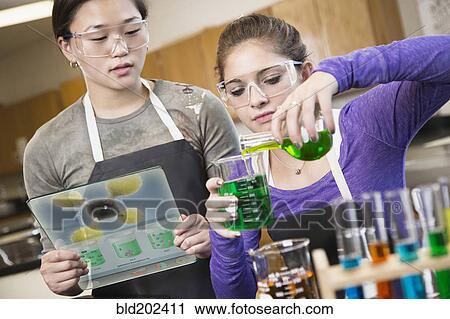 Students working with chemicals in classroom View Large Photo Image Stock Image - Students working with chemicals in classroom. Fotosearch
