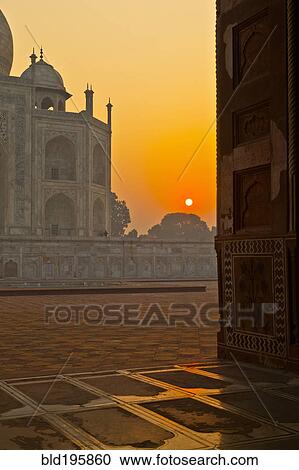 Stock Image - Sunrise over Taj Mahal. Fotosearch