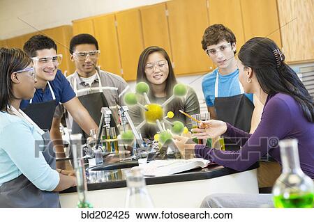 Teacher explaining chemistry model to students View Large Photo Image Stock Photography - Teacher explaining chemistry model to students. Fotosearch
