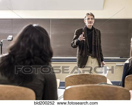 Teacher talking to students in classroom View Large Photo Image Stock Image - Teacher talking to students in classroom. Fotosearch