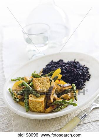 Stock Photograph - Tofu and vegetables on plate. Fotosearch