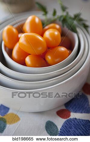 Tomatoes in stack of bowls View Large Photo Image Stock Photography - Tomatoes in stack of bowls. Fotosearch