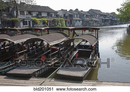 Stock Image - Traditional boat mooring at dock. Fotosearch