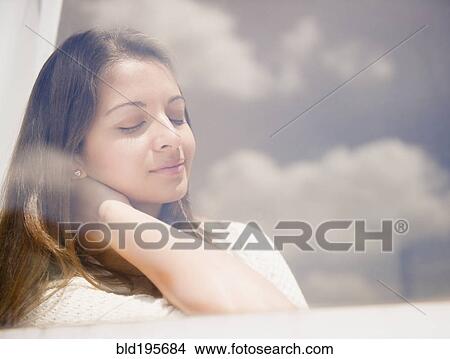 Tranquil Indian woman relaxing View Large Photo Image Picture - Tranquil Indian woman relaxing. Fotosearch