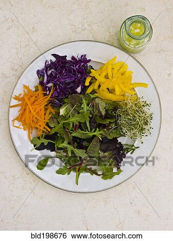 Stock Photograph - Variety of vegetables on plate. Fotosearch