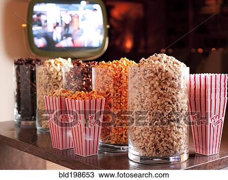 Various flavors of popcorn in containers View Large Photo Image Stock Image - Various flavors of popcorn in containers. Fotosearch