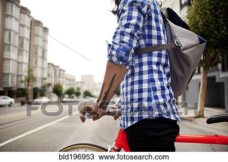 Vietnamese bicycle messenger on city street View Large Photo Image Stock Image - Vietnamese bicycle messenger on city street. Fotosearch