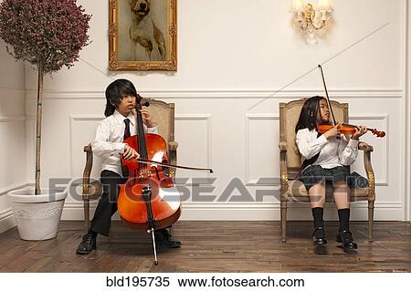 Vietnamese children with musical instruments sitting on elegant chairs View Large Photo Image Stock Photography - Vietnamese children with musical instruments sitting on elegant chairs. Fotosearch