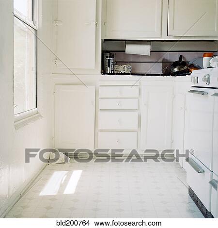 Picture - White apartment kitchen cabinets. Fotosearch