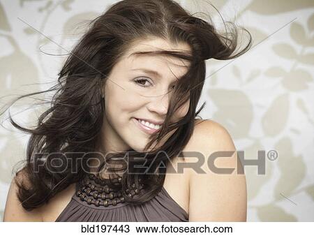 Wind blowing glamorous Caucasian woman's hair View Large Photo Image Stock Image - Wind blowing glamorous Caucasian woman's hair. Fotosearch