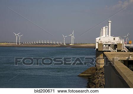 Stock Image - Wind turbines on waterfront. Fotosearch